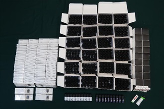 Hong Kong Customs has conducted a series of enforcement actions against the illegal import and sale of electronic cigarette oil containing Part 1 poisons since early this year. As of yesterday (July 2), Customs has detected 39 relevant cases in total and seized items suspected to be connected with the cases worth about $2.5 million. Thirty-one persons have been arrested. Photo shows some of the suspected electronic cigarette oil containing cannabidiol seized.