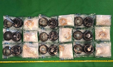 Hong Kong Customs seized about 1.1 kilograms of suspected methamphetamine with an estimated market value of about $690,000 at Hong Kong International Airport on July 4. Photo shows the suspected methamphetamine seized and the pulleys used to conceal the dangerous drugs.